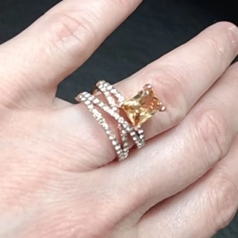 Rose gold colored ring with champagne stone Size 6
